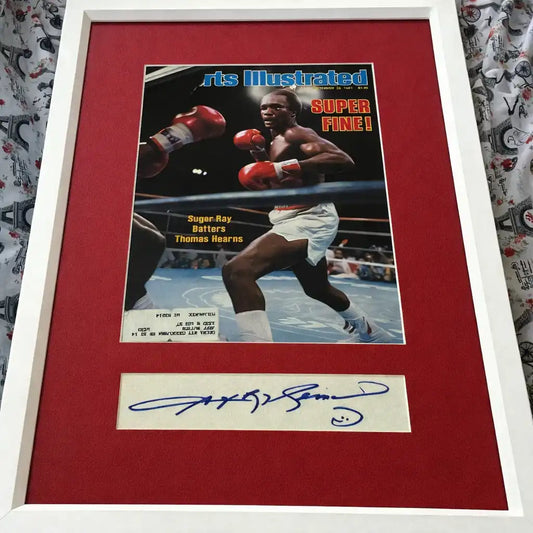 Framed Sports Illustrated cover featuring a boxer in the ring with an autograph display.