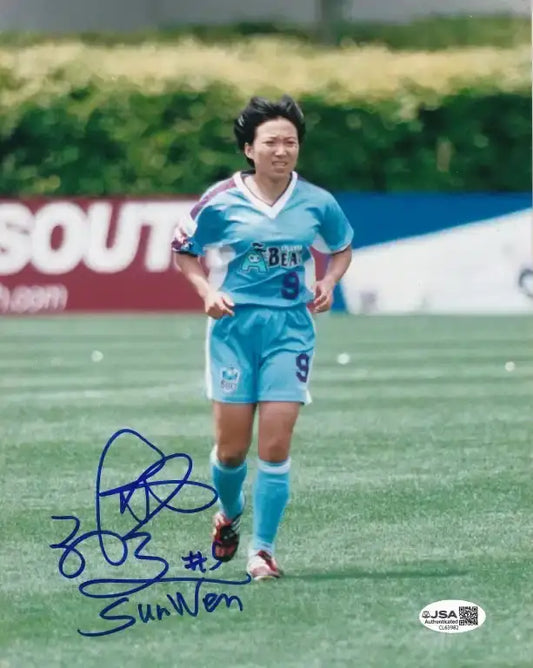 Autographed photo of Sun Wen in blue soccer jersey #9, JSA authenticated, on field during match