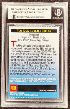 Tara Dakides snowboarder autograph card, graded by Beckett, featuring 2000 Winter X Games gold medals.