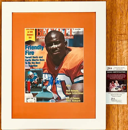 Framed Beckett football magazine signed, with JSA authentication, featuring player in orange jersey.