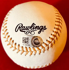 Rawlings baseball with QR code and MLB authentication sticker on red background