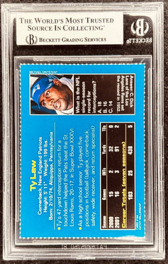 Ty Law signed Patriots 2002 SI for Kids card BAS slab - AutographsForSale.com
