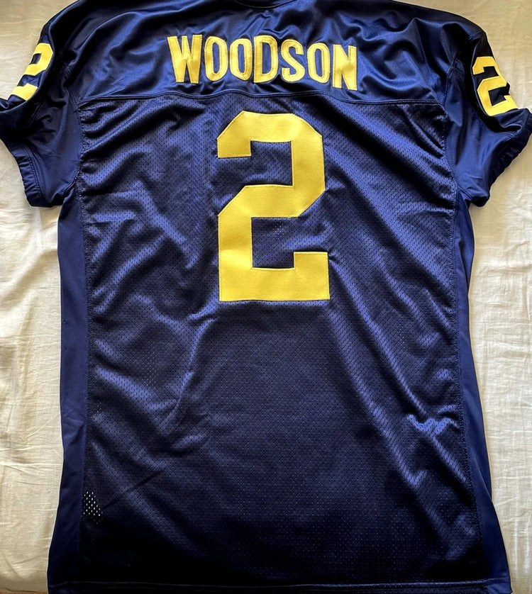 Charles Woodson Michigan Wolverines blue game cut jersey - AutographsForSale.com