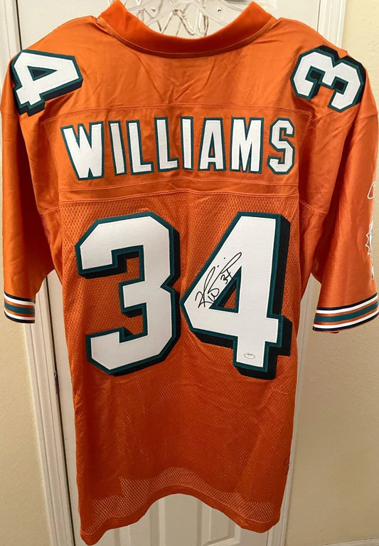Ricky Williams signed Dolphins Reebok orange jersey SCHWARTZ - AutographsForSale.com