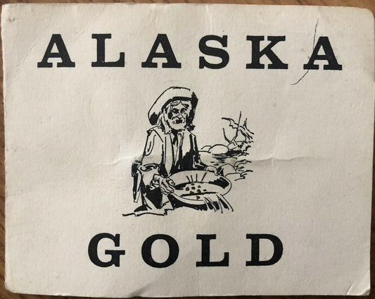 Alaska Placer Gold Flakes In Vial & Souvenir Folder - AutographsForSale.com