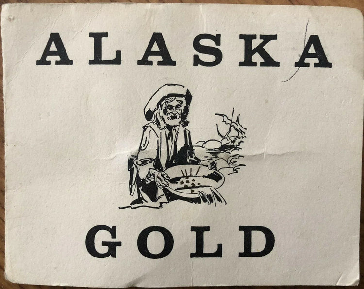Alaska Placer Gold Flakes In Vial & Souvenir Folder - AutographsForSale.com