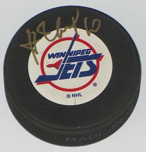 Alexei Zhamnov autographed Winnipeg Jets puck - AutographsForSale.com