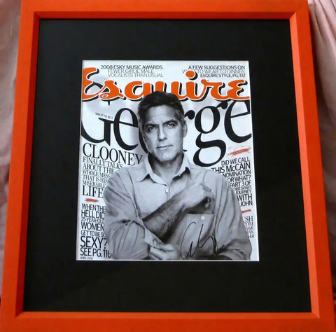 Framed George Clooney Esquire magazine cover with autograph, orange frame, black matting