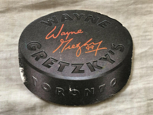 Wayne Gretzkys Toronto Restaurant 1990s puck Shaped Coaster - AutographsForSale.com