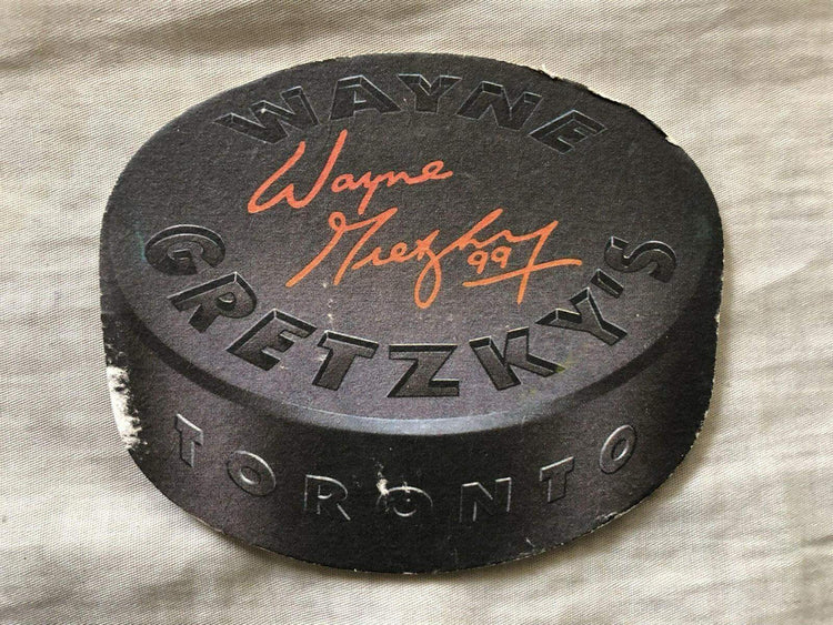Wayne Gretzkys Toronto Restaurant 1990s puck Shaped Coaster - AutographsForSale.com