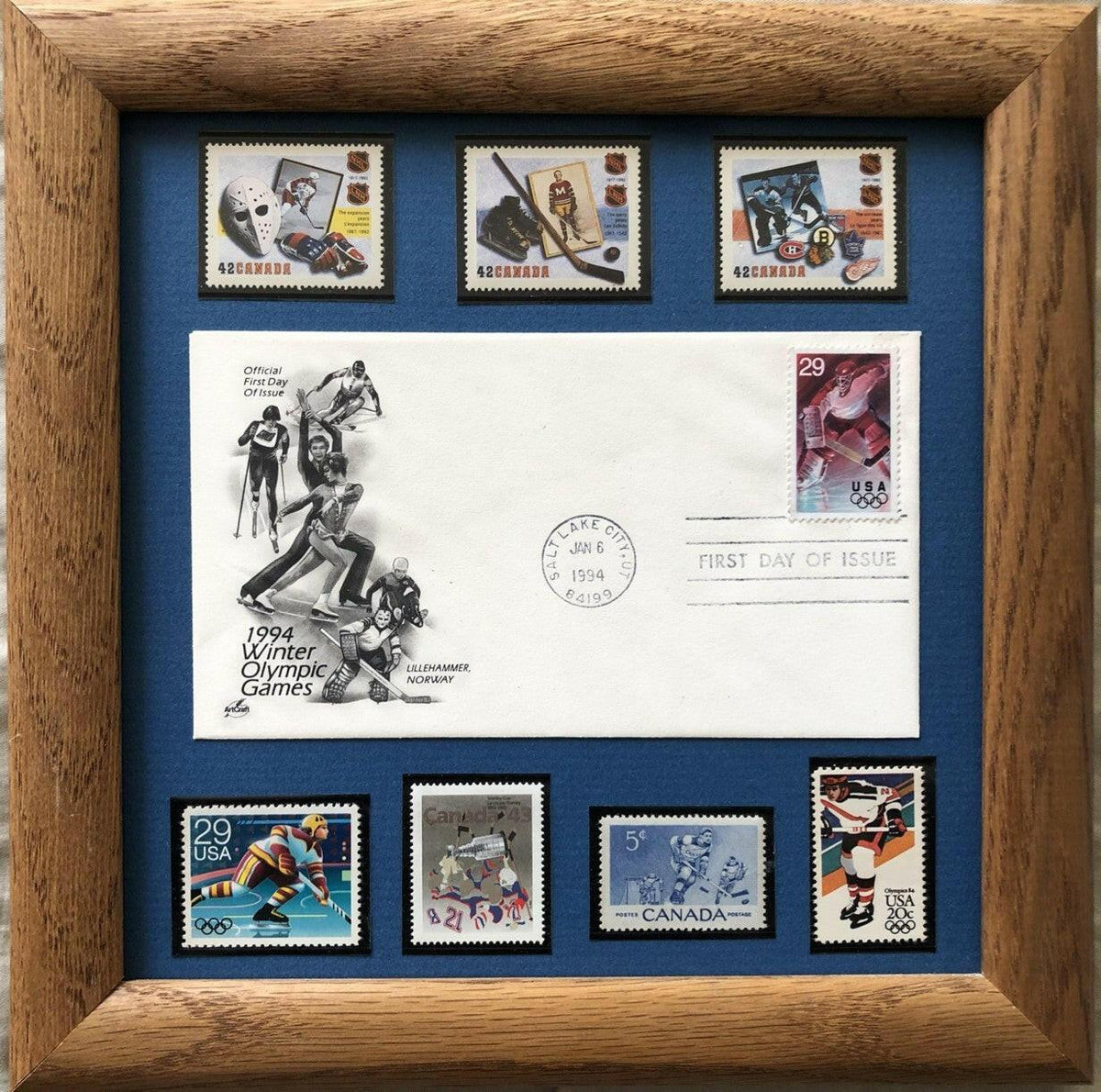 1994 Winter Olympics 1st Day cover with 7 Canada US hockey stamps framed - AutographsForSale.com