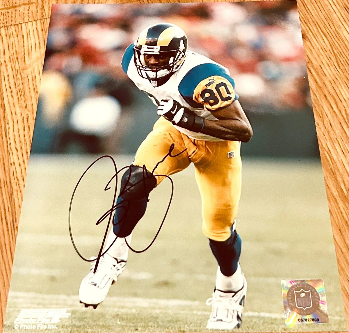 Isaac Bruce autographed St. Louis Rams 8x10 photo - AutographsForSale.com