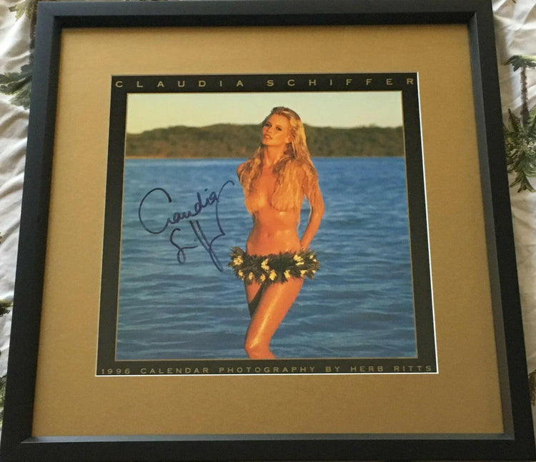 Claudia Schiffer signed 1996 Herb Ritts swimsuit calendar cover framed JSA - AutographsForSale.com