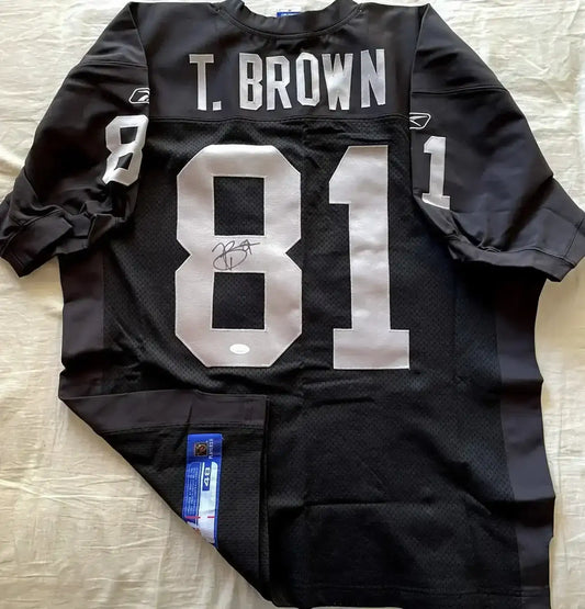 Tim Brown signed Raiders Reebok black game model jersey JSA - AutographsForSale.com