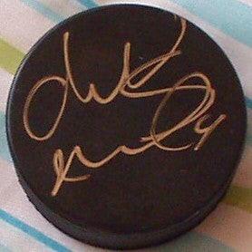Markus Naslund autographed hockey puck Canucks NY Rangers - AutographsForSale.com
