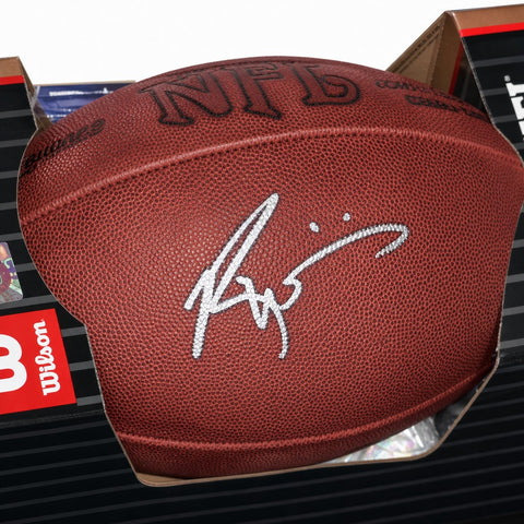 Autographed NFL football with silver signature, Wilson brand, displayed in packaging
